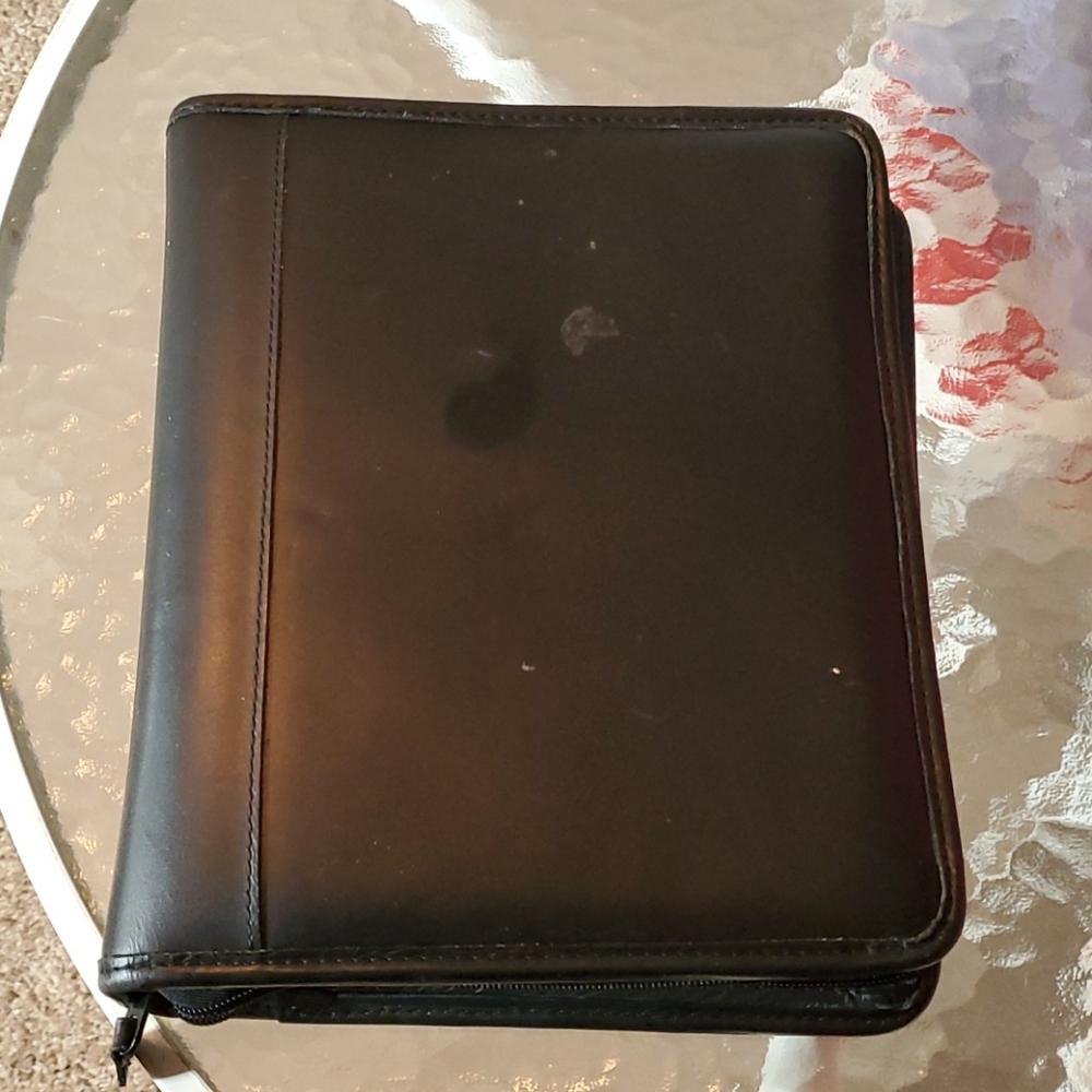 Black leather day planner zips all around
